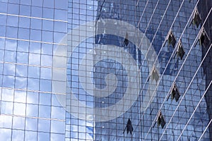 Clouds Reflected in Windows of Modern Office Building