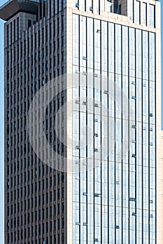 Clouds reflected in windows of modern office building