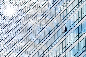 Clouds reflected in windows of modern office building