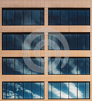 Clouds reflected in windows of an office building