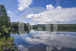 Clouds reflecting in lake Funasdalssjon