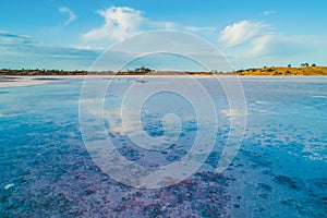 Clouds reflecting in salt lake in Australian desert.