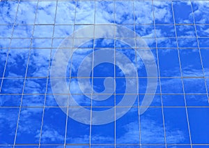 Clouds reflectionon on office building