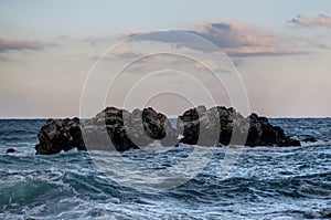 Clouds, rocks and sea
