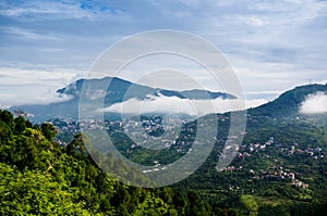 Clouds rolling between hills of himachal