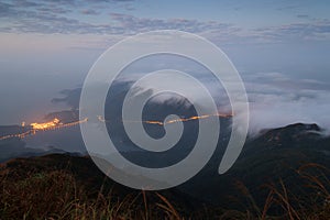 Clouds rolling over hills on the Lantau Island at dawn