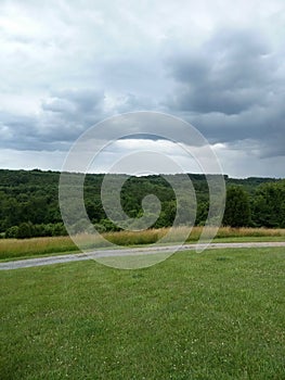 Clouds rolling in over landscape