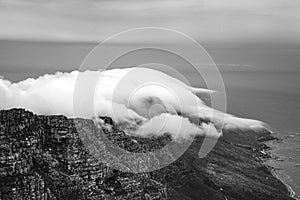 Clouds rolling over Table Mountain in Cape Town, Southafica. This fenomenon is called Tablecloth