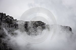 Clouds rolling over Table Mountain in Cape Town, Southafica. This fenomenon is called Tablecloth