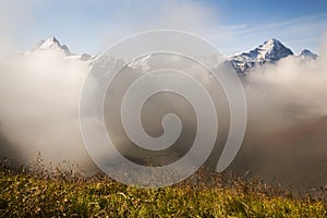 Clouds Schreckhorn and the Face of the Eiger in the Swiss Alps