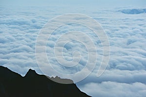The clouds seen from above on the mountain. alpine sea at the horizon