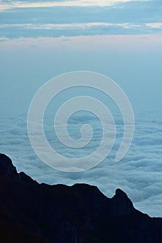 The clouds seen from above on the mountain. alpine sea at the horizon