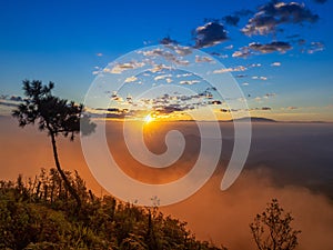 Clouds and sky background,Sunlight flare of sun at sunrise or sunset time with silhouette of mountain