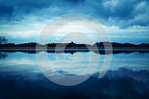 Clouds sky reflection over lake 2