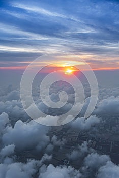 clouds sky skyscape in sunset time. view from the window of an airplane flying in the clouds, top view clouds like  the sea of