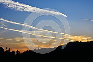 Clouds on the sky at sunset with contrails - chemtrails