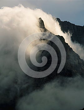 Clouds smothering peaks of the Lewis Range, Highline Trail, Glacier National Park, Montana photo