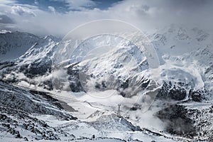 Clouds in the snowy alps
