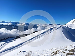 Clouds and snów in Alps mountains