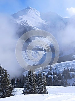 Clouds and snów in Alps mountains