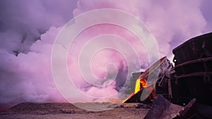 Clouds of steam formed during cooling with water during the discharge of hot incandescent blast furnace slag of metallurgical