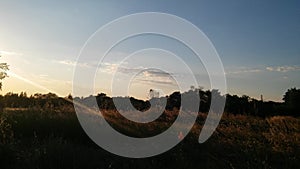 Clouds sun and a beautiful landscape