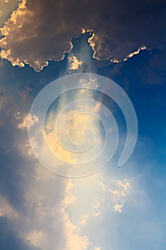 Clouds and sunbeam on blue sky