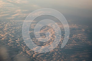 Clouds at sunset from the plane in the sky landscape