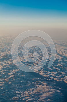 Clouds at sunset from the plane in the sky landscape