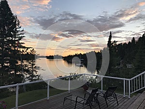 Sunset on the deck, Lake of the Woods, Kenora, Ontario, Canada photo