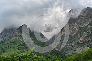 Clouds swirl over the Tsey-Loam mountain ridge