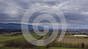 Clouds time lapse, aerial view of landscape and countryside with moving storm clouds