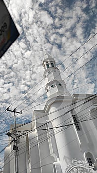 Clouds tower a mosque