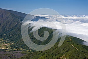 Clouds tumbling over a mountain ridge at La Palma