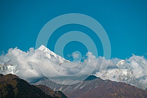 Clouds uncover from Panchachuli Peaks in Munsyari