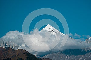 Clouds uncover from Panchachuli Peaks in Munsyari