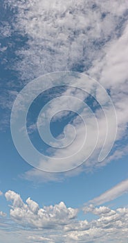 Clouds in vertical blue sky panorama format