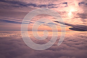 Clouds view from the airplane, Flying over the evening timelapse clouds with the late sun. Flight through moving cloudscape with