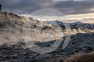 Clouds of water vapor smelling sulfur sprouts in the Hverir volcanic area, Iceland