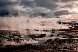 Clouds of water vapor smelling sulfur sprouts in the Hverir volcanic area, Iceland