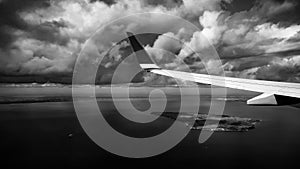 Clouds and wing outside the window in a aircraft