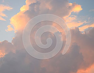 Cloudscape - Abstract Natural Background - Yellowish Orange and Dark Cumulonimbus Clouds in Blue Sky