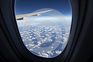 Cloudscape against blue sky through air plane window