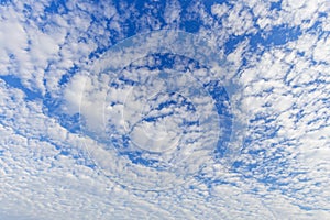 Cloudscape with altocumulus clouds, Altocumulus middle-altitude cloud in stratocumuliform photo