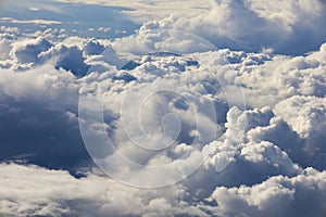 Cloudscape with Altocumulus and cumulonimbus clouds from a plane