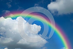 Cloudscape with blue sky and white clouds rainbow