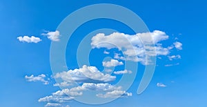 Cloudscape nature background. Blue sky and white clouds, wide panorama Free fly freedom