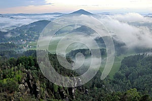 Cloudscape over green valley