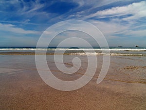 Cloudscape over sandy beach