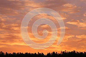 Cloudscape panorama over sunser sky.